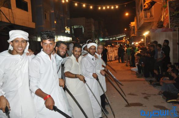 بالصور:المواكب الحسينية في ليلة التاسع من المحرم في الناصرية