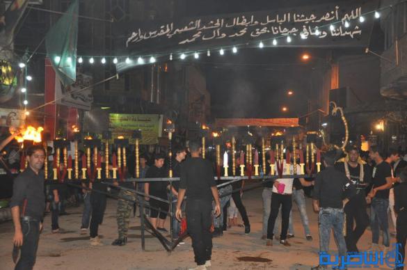 بالصور:المواكب الحسينية في ليلة التاسع من المحرم في الناصرية