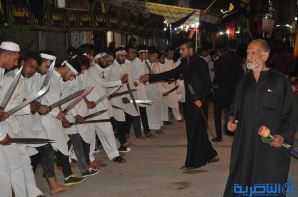 بالصور:المواكب الحسينية في ليلة التاسع من المحرم في الناصرية