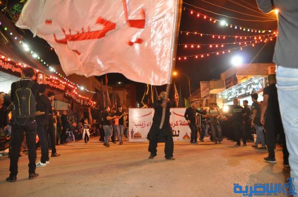 بالصور:احياء ذكرى ليلة التاسع من المحرم في مدينة الناصرية