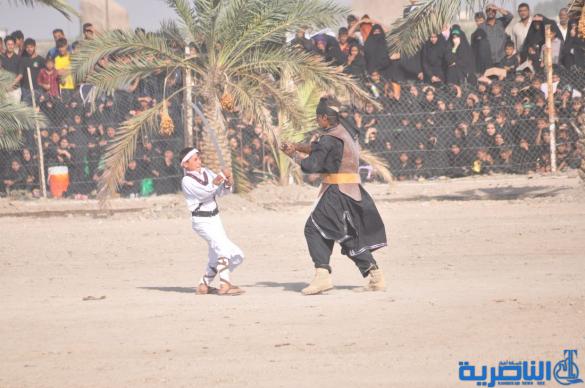 بالصور:الناصرية تنظم عرض لتشابيه واقعة الطف في يوم العاشر من شهر محرم
