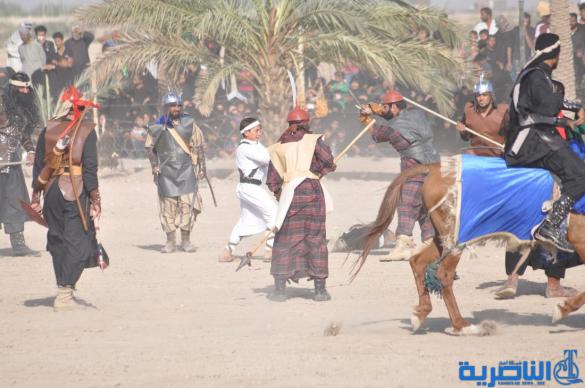 بالصور:الناصرية تنظم عرض لتشابيه واقعة الطف في يوم العاشر من شهر محرم