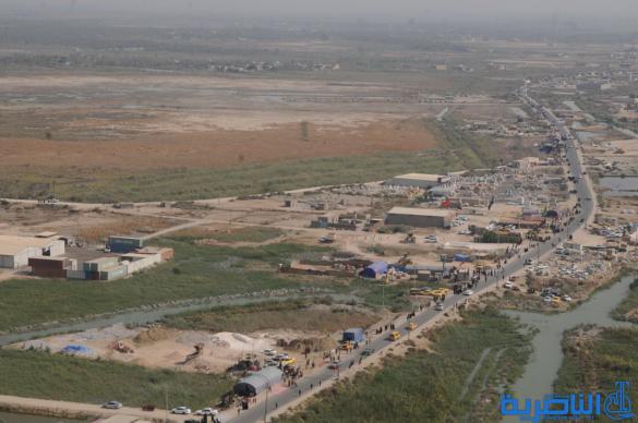 تصوير من الجو لحركة جموع الزائرين نحو كربلاء 