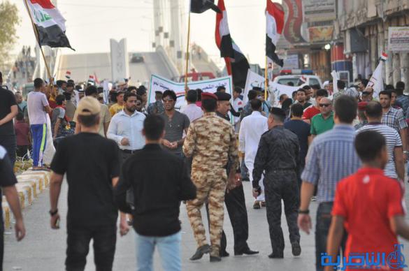 شرطة ذي قار تعزز اجراءاتها الامنية قرب الحبوبي لتامين المتظاهرين - تقرير مصور -