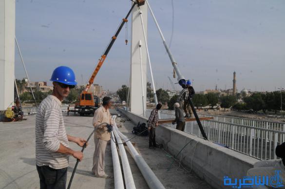 بالصور : اول الجسور المعلقة في الناصرية ، يمد حباله فوق الفرات 