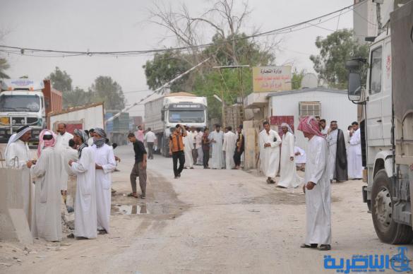 شاحنات الحبوب تصطف بطوابير امام سايلو الناصرية ، واتهامات لموظفيه بالتقصير – تقرير مصور –