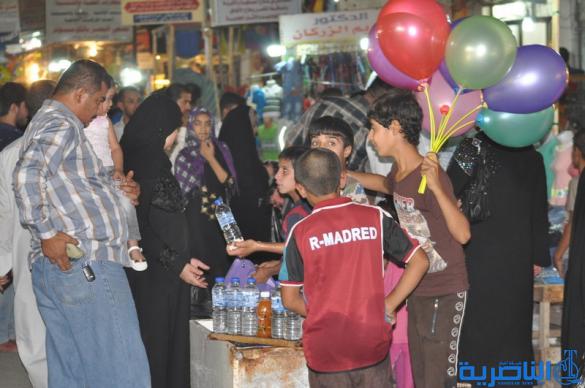 بالصور : اسواق الناصرية لا تنام الليل ، ودكاكينها عامرة بهدايا العيد