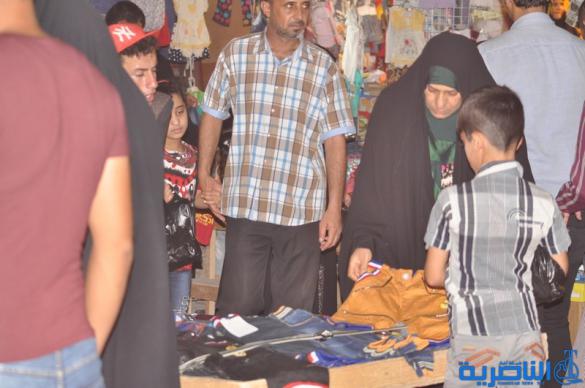 بالصور : اسواق الناصرية لا تنام الليل ، ودكاكينها عامرة بهدايا العيد