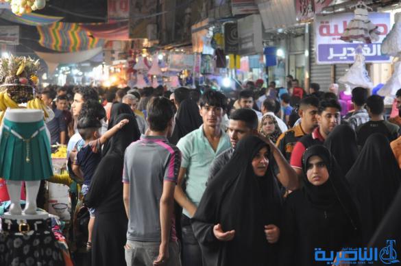 بالصور : اسواق الناصرية لا تنام الليل ، ودكاكينها عامرة بهدايا العيد