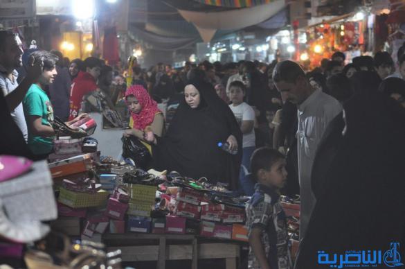 بالصور : اسواق الناصرية لا تنام الليل ، ودكاكينها عامرة بهدايا العيد