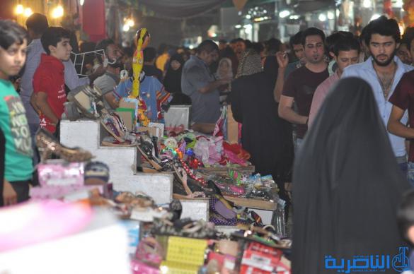 بالصور : اسواق الناصرية لا تنام الليل ، ودكاكينها عامرة بهدايا العيد