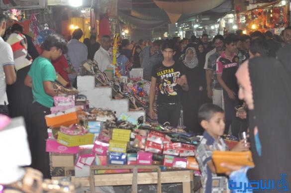 بالصور : اسواق الناصرية لا تنام الليل ، ودكاكينها عامرة بهدايا العيد