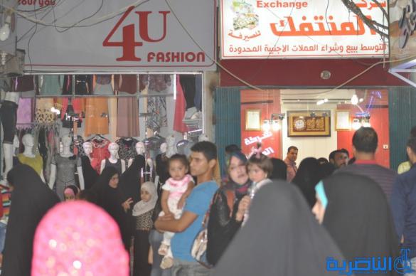 بالصور : اسواق الناصرية لا تنام الليل ، ودكاكينها عامرة بهدايا العيد