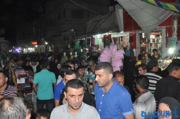 بالصور : اسواق الناصرية لا تنام الليل ، ودكاكينها عامرة بهدايا العيد