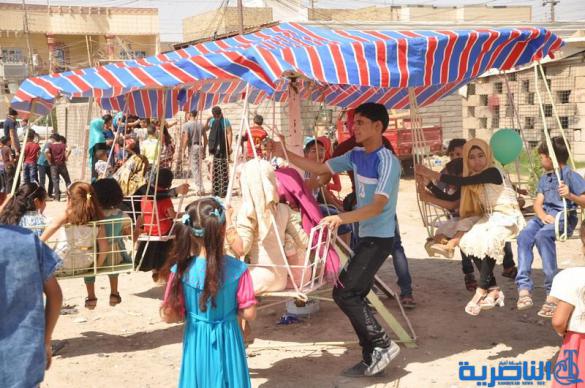 بالصور:اطفال ذوي الدخل المحدود في الناصرية يقضون ايام عيد الفطر بساحات خاوية