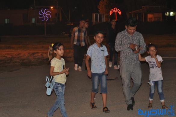 بالصور:فرحة العيد مرتسمة على وجوه العوائل في الناصرية
