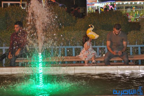 بالصور:فرحة العيد مرتسمة على وجوه العوائل في الناصرية