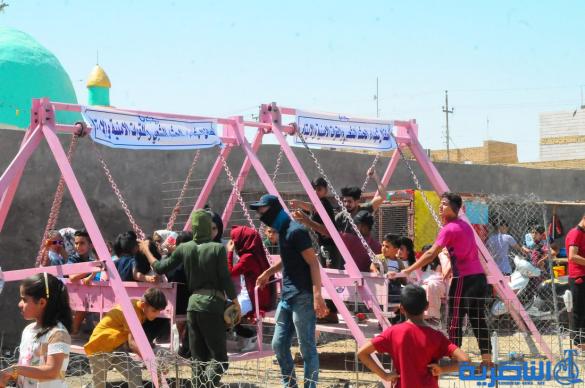 بالصور:اطفال الناصرية يقضون اول ايام عيد الفطر بالساحات والمتنزهات العامة