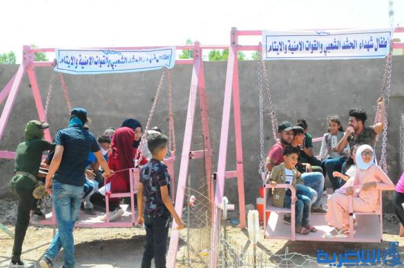 بالصور:اطفال الناصرية يقضون اول ايام عيد الفطر بالساحات والمتنزهات العامة