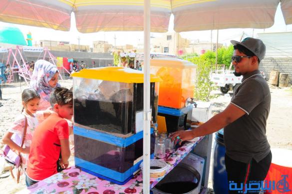 بالصور:اطفال الناصرية يقضون اول ايام عيد الفطر بالساحات والمتنزهات العامة