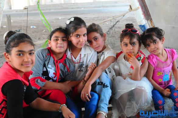 بالصور:اطفال الناصرية يقضون اول ايام عيد الفطر بالساحات والمتنزهات العامة