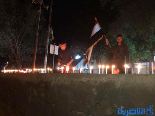 بالصور:ابناء قلعة سكر يوقدون الشموع استذكارا لضحايا حادثة الموصل