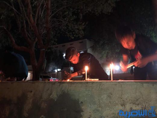 بالصور:ابناء قلعة سكر يوقدون الشموع استذكارا لضحايا حادثة الموصل