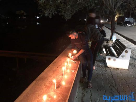 بالصور:ابناء قلعة سكر يوقدون الشموع استذكارا لضحايا حادثة الموصل