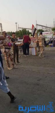 بالصور:موكب حسيني لقاعدة الامام علي الجوية خدمة لزوار الاربعين 