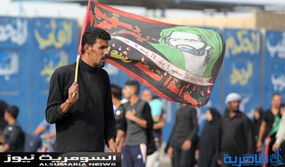  بالصور.. يدٌ تطعم وأخرى تحمي الزائرين الوافدين على كربلاء