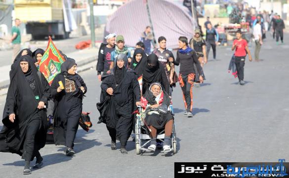  بالصور.. يدٌ تطعم وأخرى تحمي الزائرين الوافدين على كربلاء