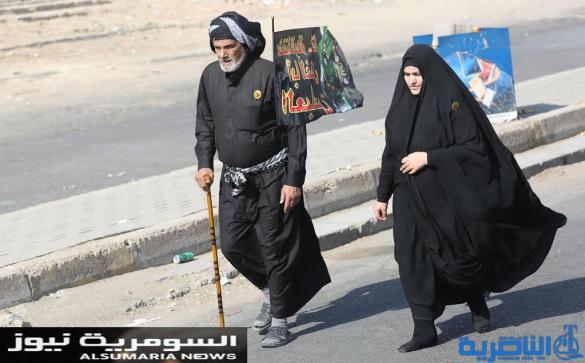  بالصور.. يدٌ تطعم وأخرى تحمي الزائرين الوافدين على كربلاء