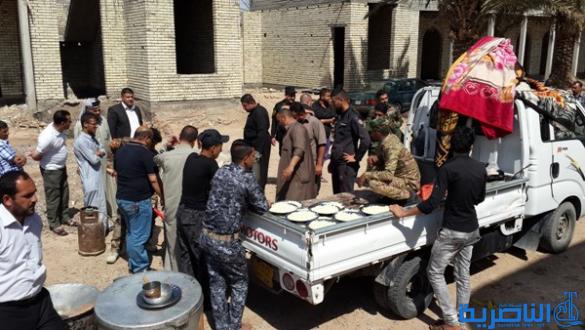 بالصور :الرفاعي ترسل مائة طن من الاغذية الى الحشد الشعبي في صلاح الدين