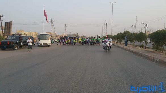 مركز الناصرية للقلب يستثمر فرحة النصر في الموصل وينظم ركضة جماهيرية في الناصرية - تقرير مصور - 