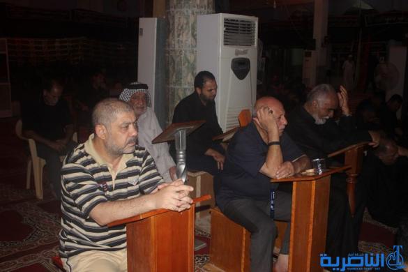 بالصور:موكب جمعية التضامن الاسلامي يحيي ليلة الحادي عشر من المحرم بمسيرة من الشموع
