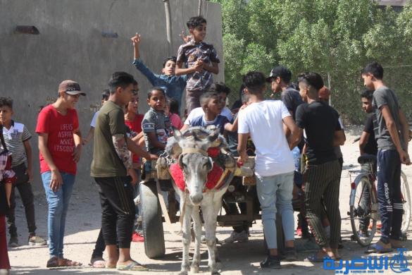 بالصور:اطفال الناصرية في اول ايام عيد الاضحى المبارك