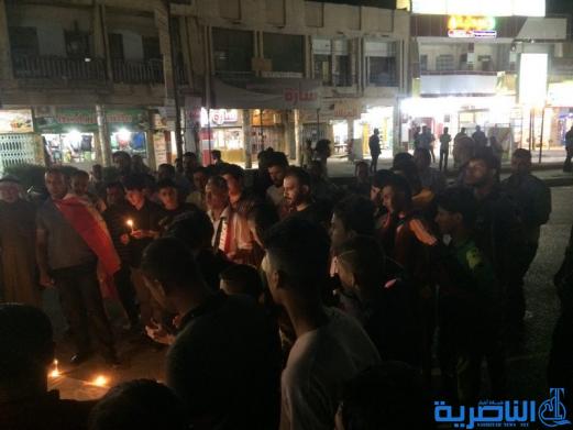 بالصور: الناصرية توقد الشموع حزنا على شهداء الكرادة