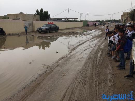 بالصور : الى بلدية الناصرية ، هذه شوارعكم بعد ليلة مطر واحدة