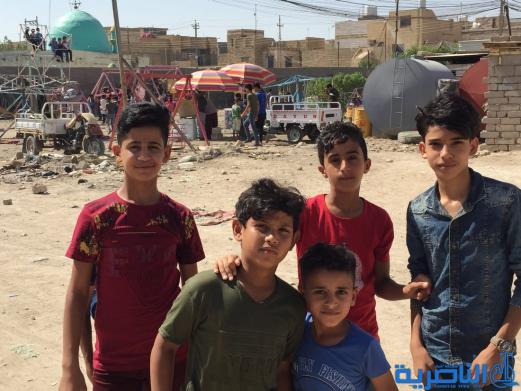 بالصور:اطفال الناصرية في اول ايام عيد الاضحى المبارك