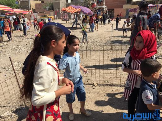 بالصور:اطفال الناصرية في اول ايام عيد الاضحى المبارك