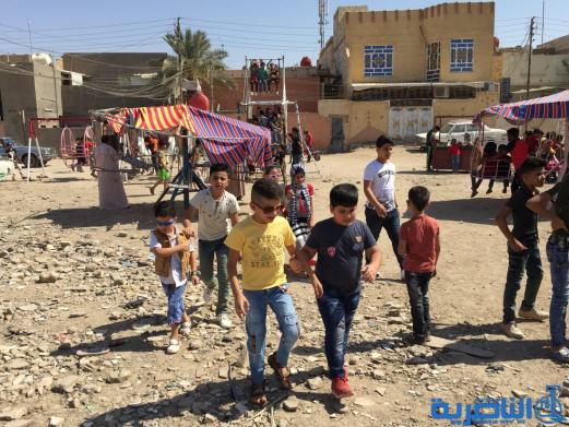 بالصور:اطفال الناصرية في اول ايام عيد الاضحى المبارك