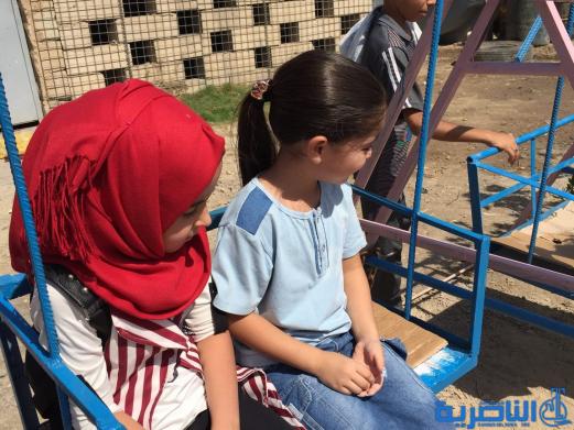 بالصور:اطفال الناصرية في اول ايام عيد الاضحى المبارك