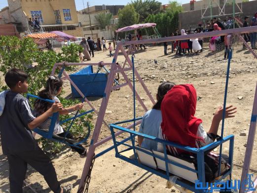بالصور:اطفال الناصرية في اول ايام عيد الاضحى المبارك