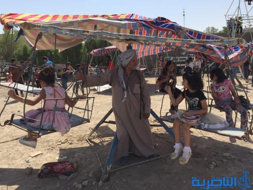 بالصور:اطفال الناصرية في اول ايام عيد الاضحى المبارك