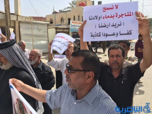 متظاهرون من ذوي الشهداء  .. بلدية الناصرية وزعت علينا اراضي متجاوز عليها -تقرير مصور -