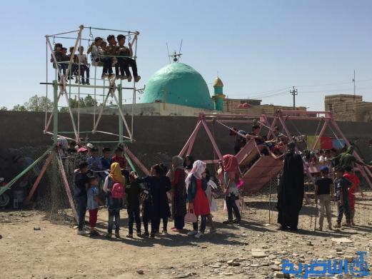 بالصور:اطفال الناصرية في اول ايام عيد الاضحى المبارك