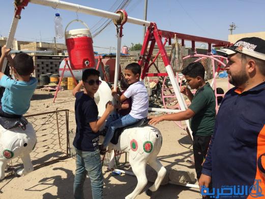 بالصور:اطفال الناصرية في اول ايام عيد الاضحى المبارك