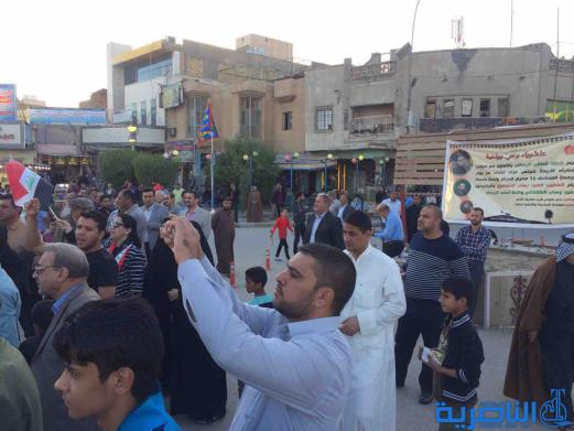 بالصور : متظاهرو الناصرية يدعون الامم المتحدة للوقوف مع العراق في حربه ضد الارهاب