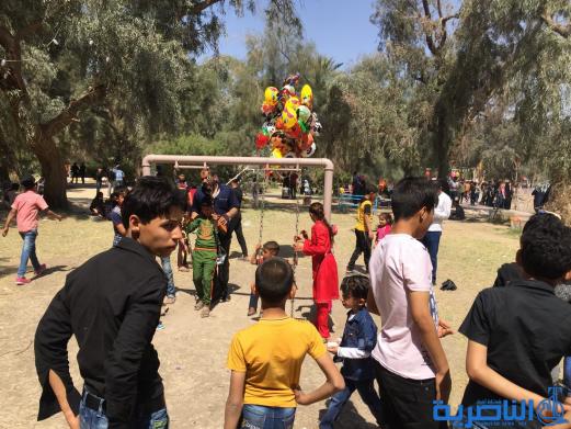 بالصور:مئات العوائل في الناصرية تحتفل بعيد النوروز