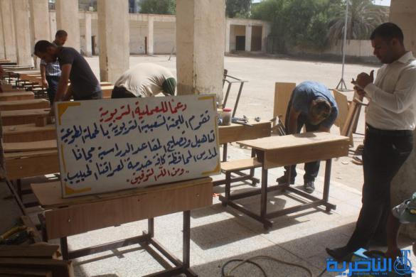 تربويون متطوعون يقومون بحملة لتصليح المساطب الدراسية في ذي قار - تقرير مصور -